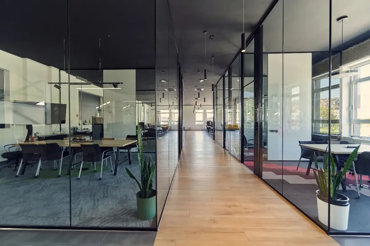 Glass-walled office interior representing Officer XConnect